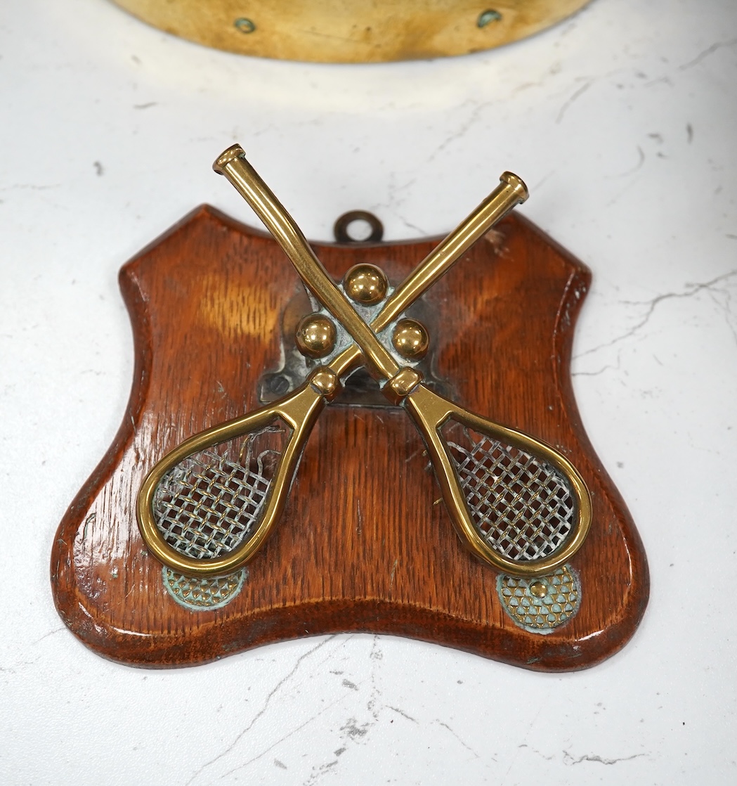 An early 19th century oak candlebox, an iron oil lamp, a brass miner’s lamp, a small brass bound coopered vessel and a paper clip in the form of Real Tennis rackets, candlebox 39cm high. Condition - fair to good